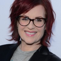 Megan Mullally Short Messy Red Hairstyle for Women Over 50