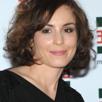Noomi Rapace Short Curly Hairstyle for Round Faces