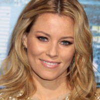 Celebrity Layered Medium Wavy Hairstyle from Elizabeth Banks