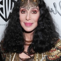 Cher Medium Black Curly Hairstyle for Women Over 60