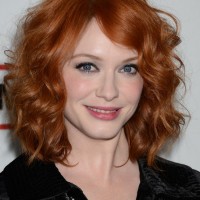 Christina Hendricks Medium Red Curly Hairstyle for Mature Women