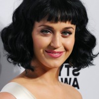 Katy Perry Short Black Wavy Hairstyle with Baby Bangs