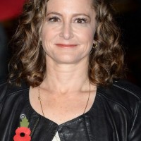 Nina Jacobson Shoulder Length Curly Hairstyle for Round Faces