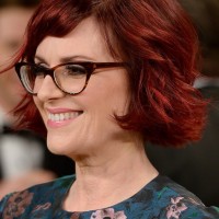 Side View of Megan Mullally Layered Red Razor Cut